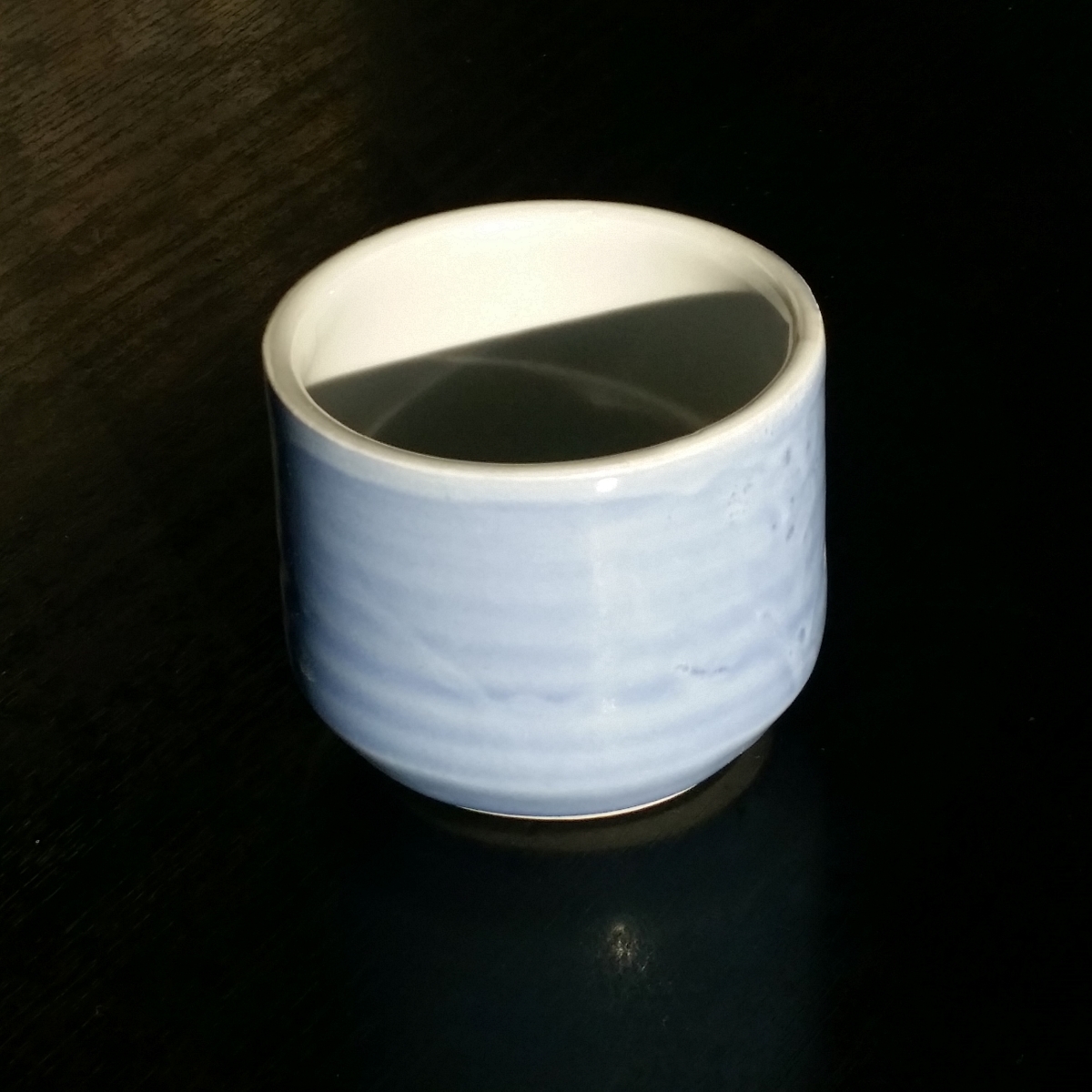 Coffee cup (no handle) in blue & green by Clifton Hill Pottery in